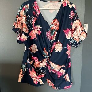 Blue floral blouse with fluttery sleeves and v-neck design